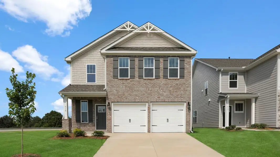 Front exterior of a new home in Adams Glen, Greenville, SC, highlighting curb appeal (Image 1). Front exterior of a new home in Adams Glen, Greenville, SC, highlighting curb appeal (Image 1).