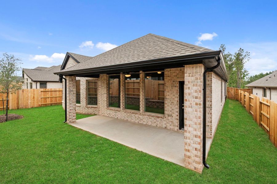 Exterior details and patio area of a home in Wildtree, Magnolia (Image 4).
