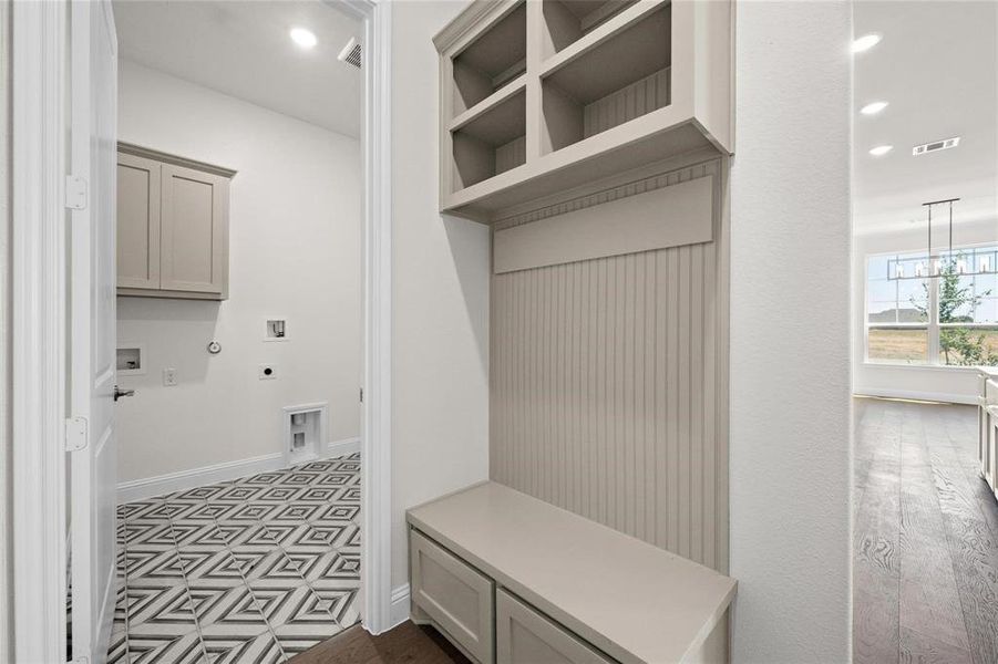 Mudroom with a chandelier