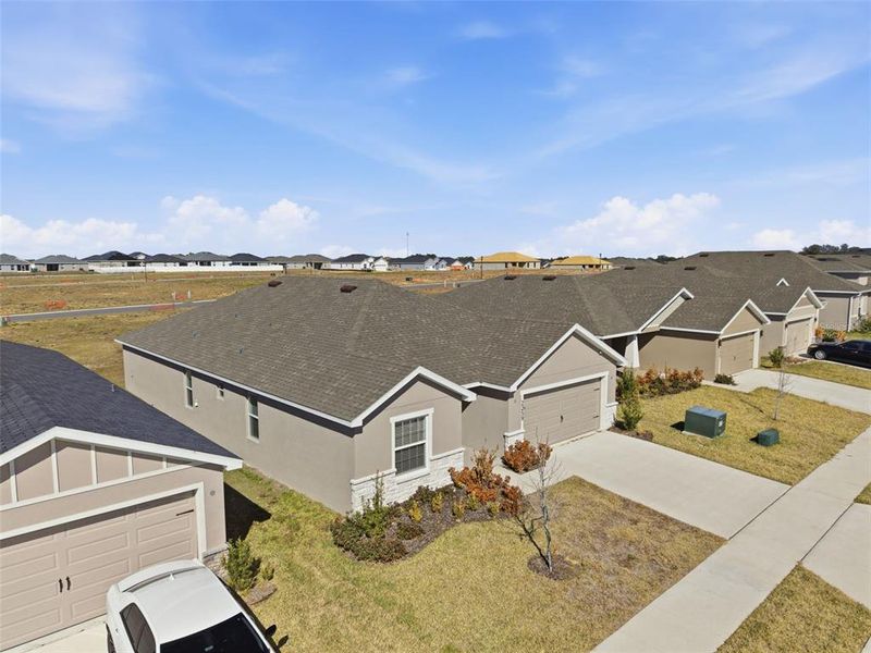 Front exterior of a new home in , Davenport, FL, highlighting curb appeal (Image 25).