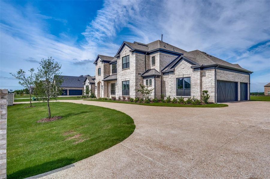 View of property exterior featuring a garage and a yard