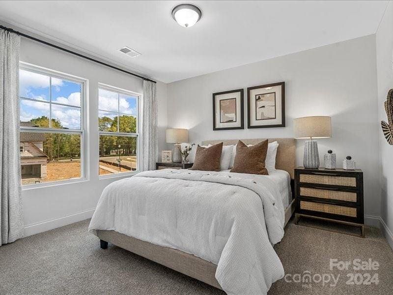 PHOTO REPRESENTATION ONLY. Bedroom 2 of decorated model home.