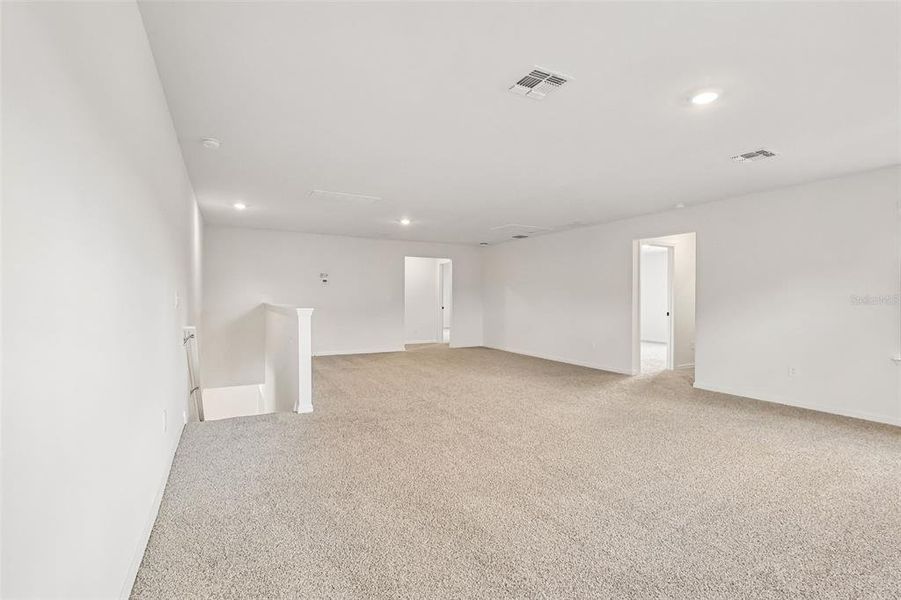 Spacious, unfurnished interior of a new home in The Grove at Stuart Crossing - Signature Series, Bartow (Image 32).