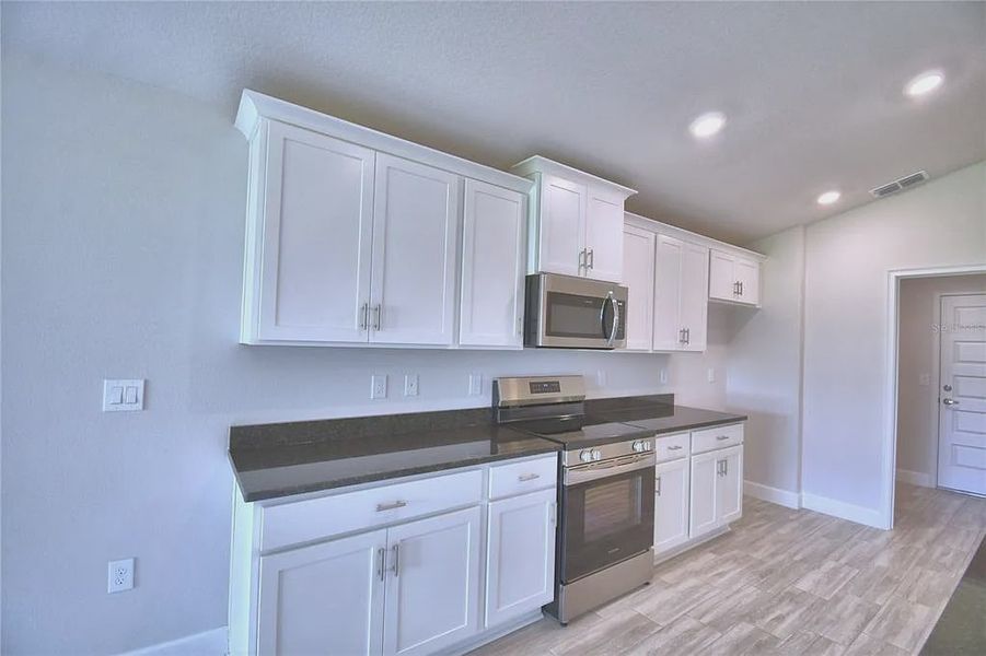 Furnished interior view inside a new home in Lake Juliana Estates, Auburndale (Image 6).