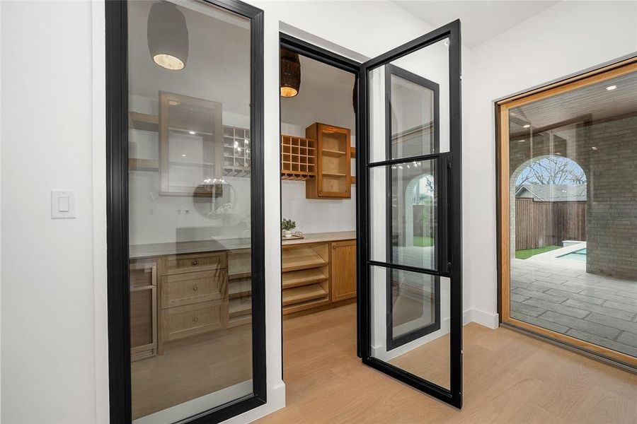 Doorway featuring wood finished floors Doorway featuring wood finished floors