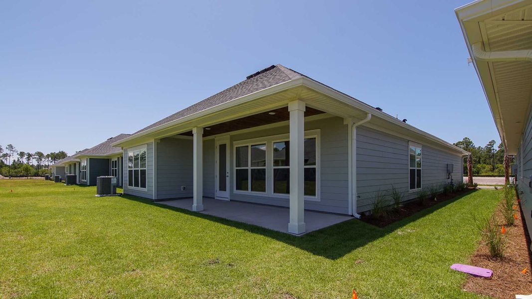 Front exterior of a new home in Breakfast Point East Phase I, Panama City Beach, FL, highlighting curb appeal (Image 24).