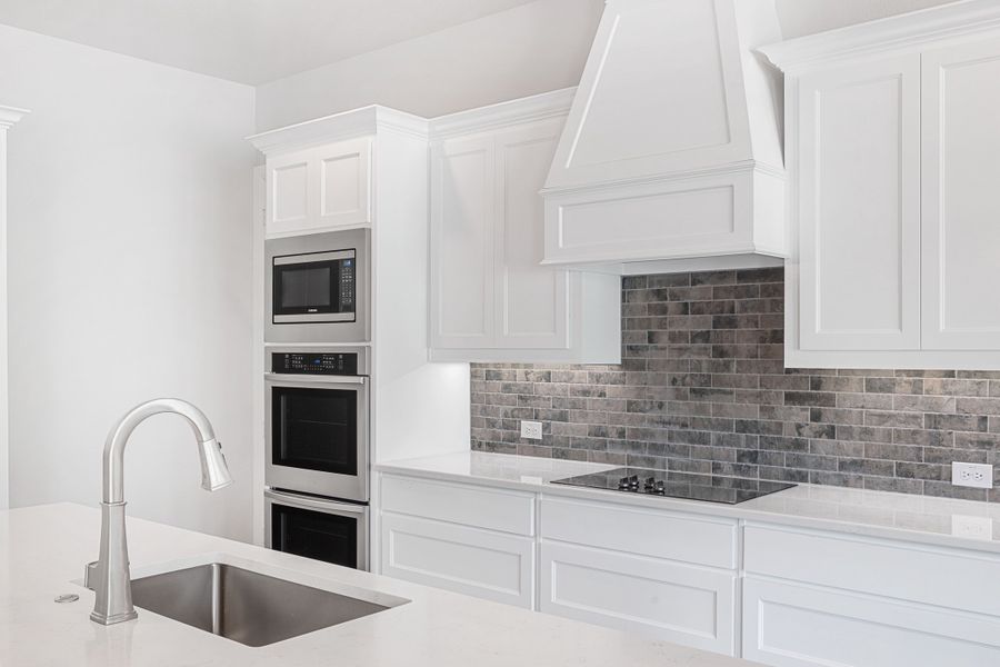 Representative furnished interior of a home built from the The Braden II by Doug Parr Custom Homes in Kessler Farms, Brock (Image 12).