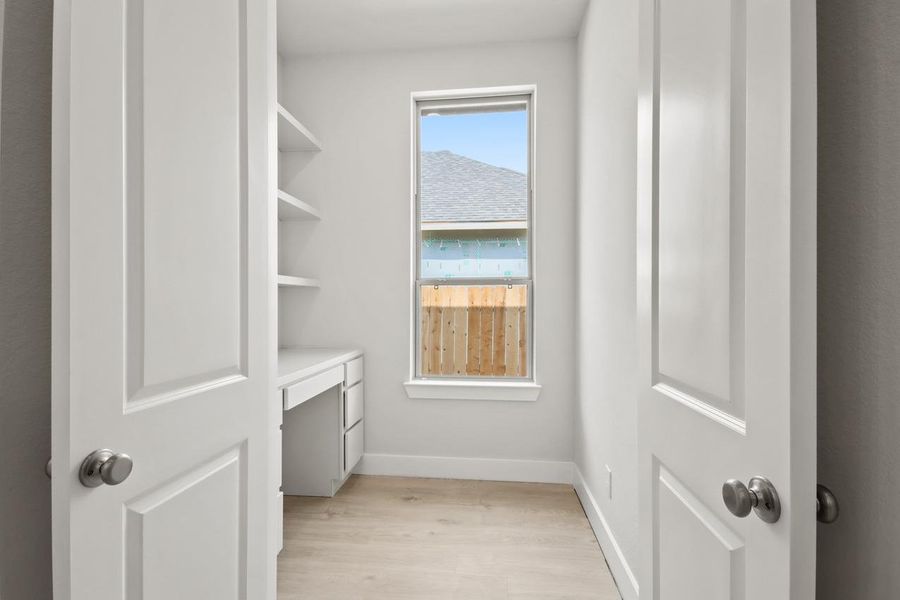 Spacious closet with light wood finished floors Spacious closet with light wood finished floors