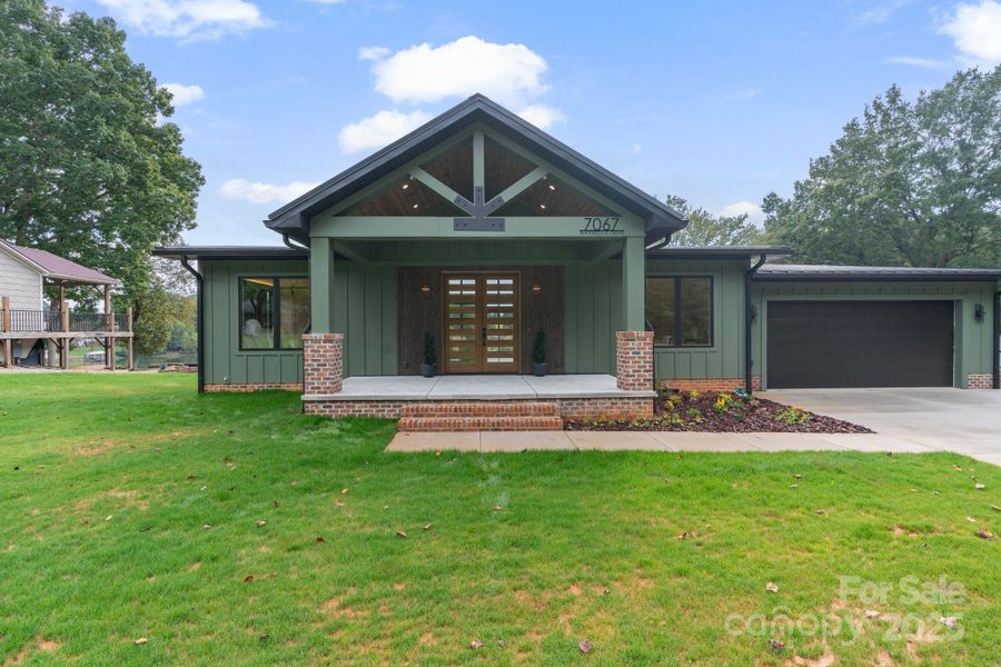 Mid-century modern vibes throughout this new waterfront home, situated on quiet cove with deep water Mid-century modern vibes throughout this new waterfront home, situated on quiet cove with deep water