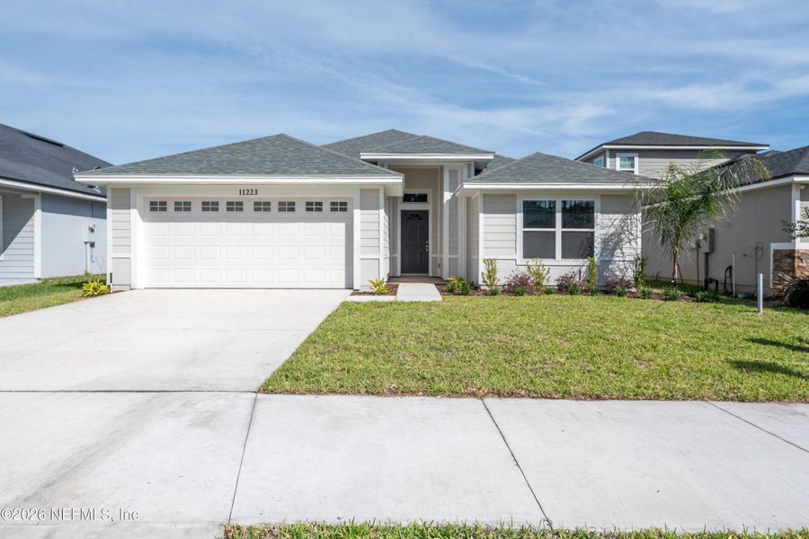 Front exterior of a new home in , Jacksonville, FL, highlighting curb appeal (Image 16).