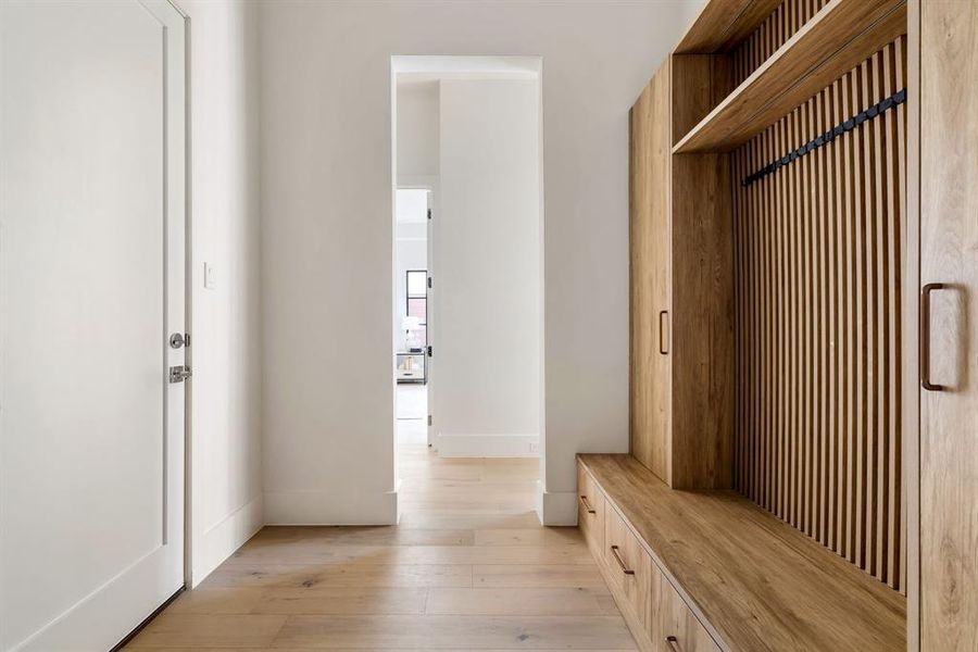 Mudroom featuring light wood finished floors and baseboards Mudroom featuring light wood finished floors and baseboards