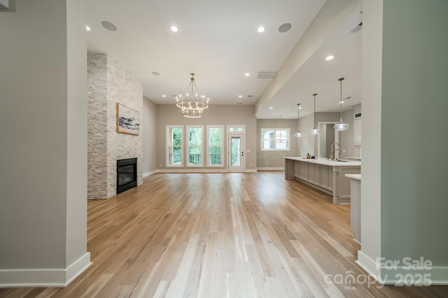 Gorgeous Open Concept Living overlooking Lake Norman with 12 foot ceilings and a stunning stacked stone fireplace