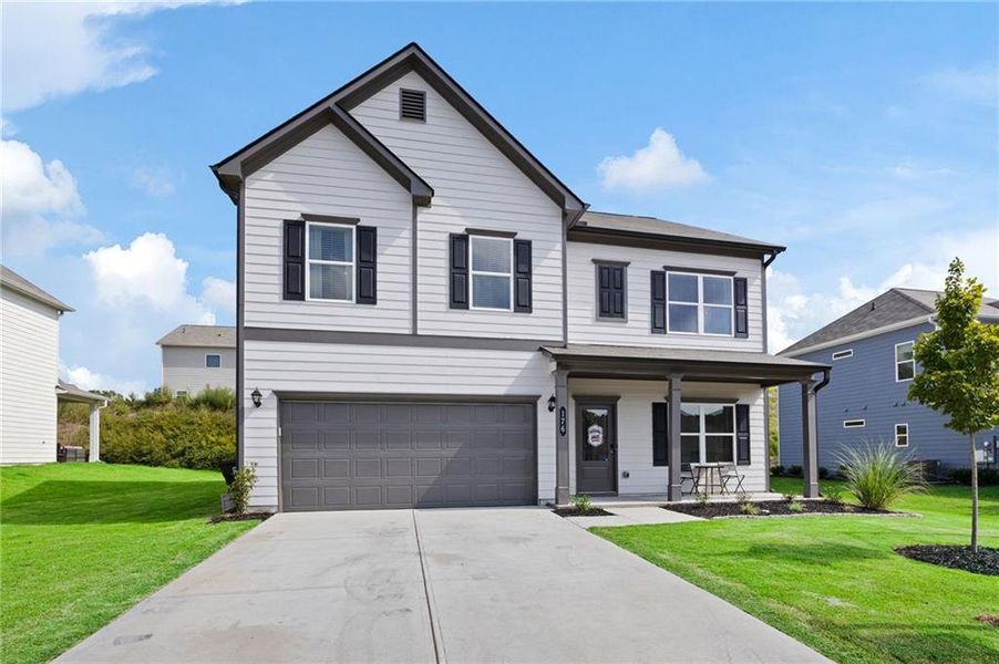 Front exterior of a new home in , Dallas, GA, highlighting curb appeal (Image 20).