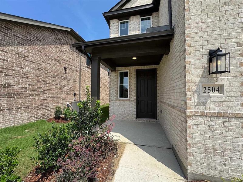 Front exterior of a new home in Devonshire 40s, Forney, TX, highlighting curb appeal (Image 15). Front exterior of a new home in Devonshire 40s, Forney, TX, highlighting curb appeal (Image 15).