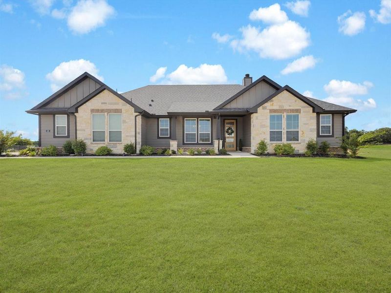 Front exterior of a new home in Regent Park, Springtown, TX, highlighting curb appeal (Image 21).