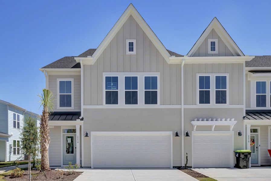 Front exterior of a new home in Grand Park, Leland, NC, highlighting curb appeal (Image 1).