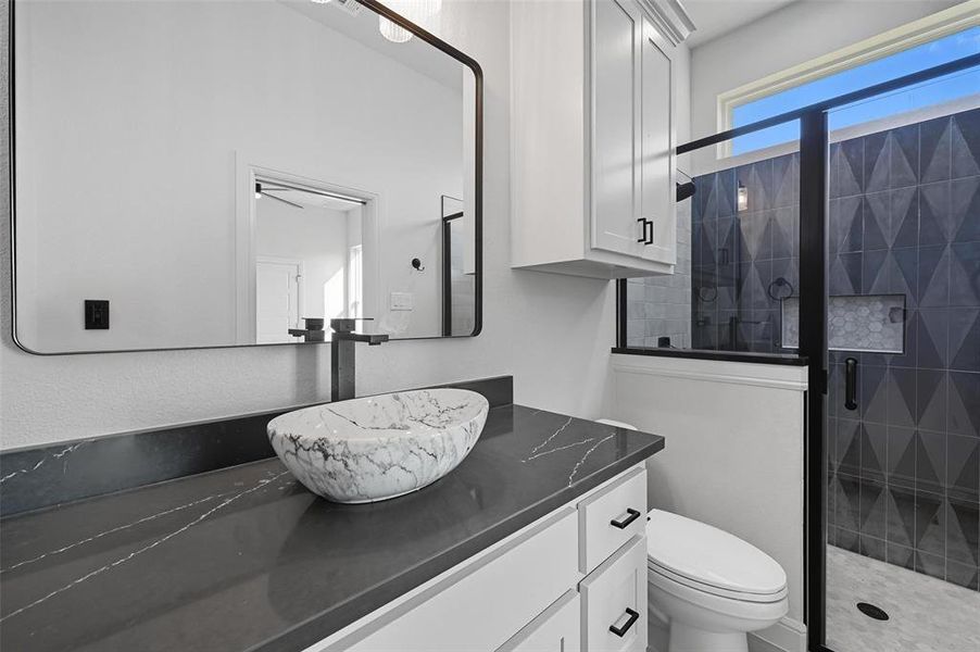 Bathroom with a stall shower and vanity Bathroom with a stall shower and vanity