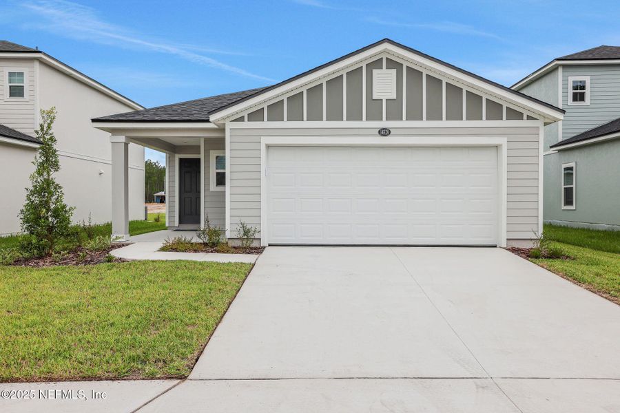 Front exterior of a new home in Bellbrooke, Jacksonville, FL, highlighting curb appeal (Image 17).