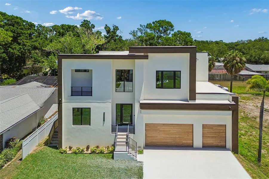 Front exterior of a new home in , Tampa, FL, highlighting curb appeal (Image 30).