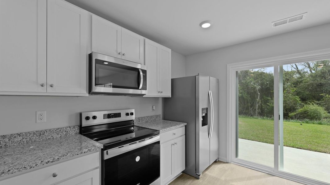 Representative furnished interior of a home built from the BRANDON by D.R. Horton in Center Pointe, Santee (Image 4).