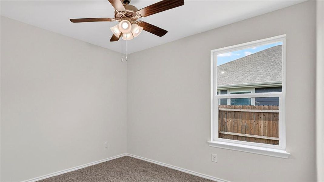 Light-colored walls with a single window featuring a white frame Light-colored walls with a single window featuring a white frame