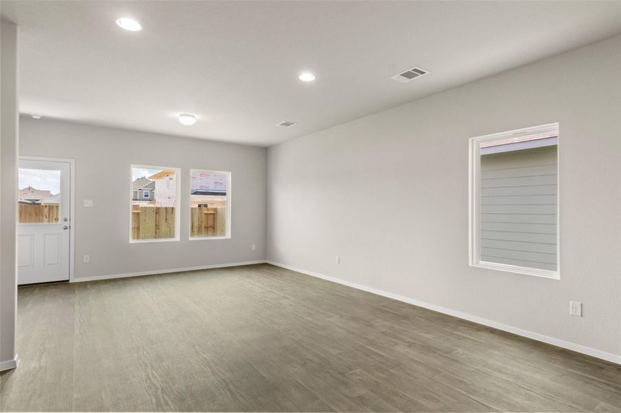Unfurnished room featuring recessed lighting and wood finished floors