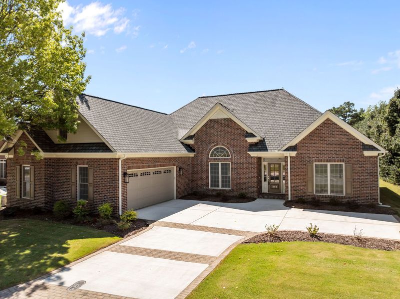 Front exterior of a new home in , Winterville, NC, highlighting curb appeal (Image 1).