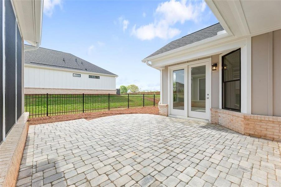 Exterior details and patio area of a home in The Courtyards of Franklin Goldmine, Cumming (Image 3).