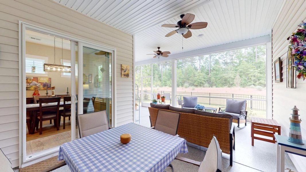 Exterior details and patio area of a home in Summerwind Crossing at Lakes of Cane Bay, Summerville (Image 25).