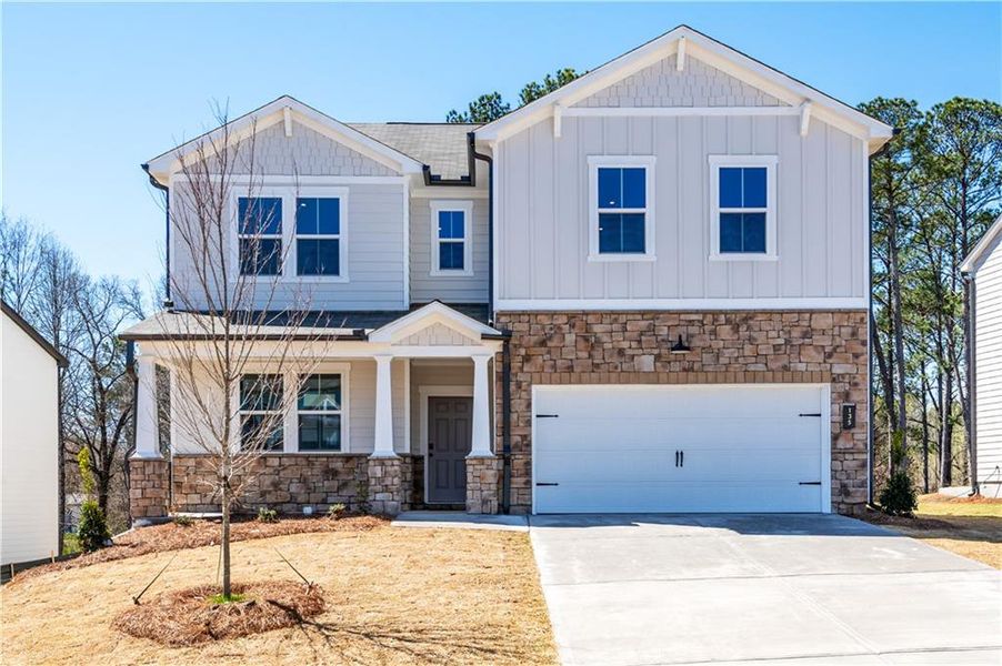 Front exterior of a new home in Cambridge at Steels Bridge, Canton, GA, highlighting curb appeal (Image 2).