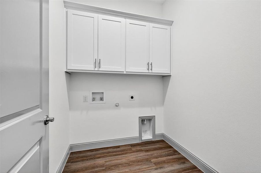 Laundry room with dark wood-style flooring, electric dryer hookup, washer hookup, cabinet space, and hookup for a gas dryer