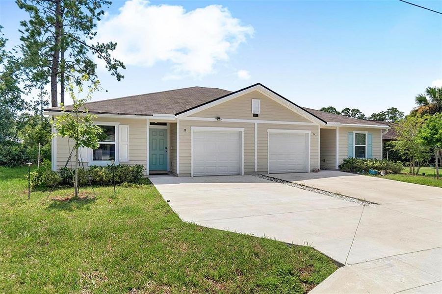 Front exterior of a new home in , Palm Coast, FL, highlighting curb appeal (Image 22).