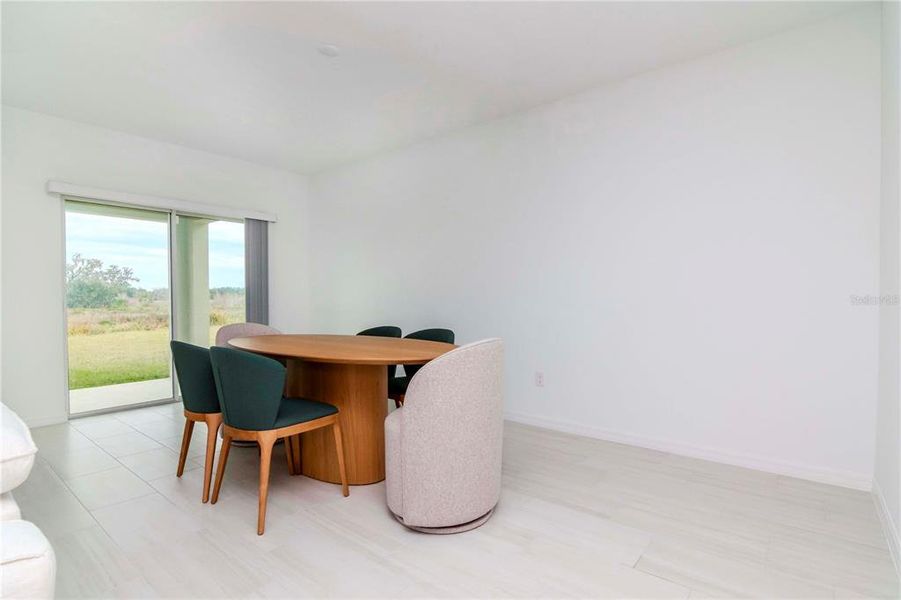 Dining Area overlooking lanai and backyard