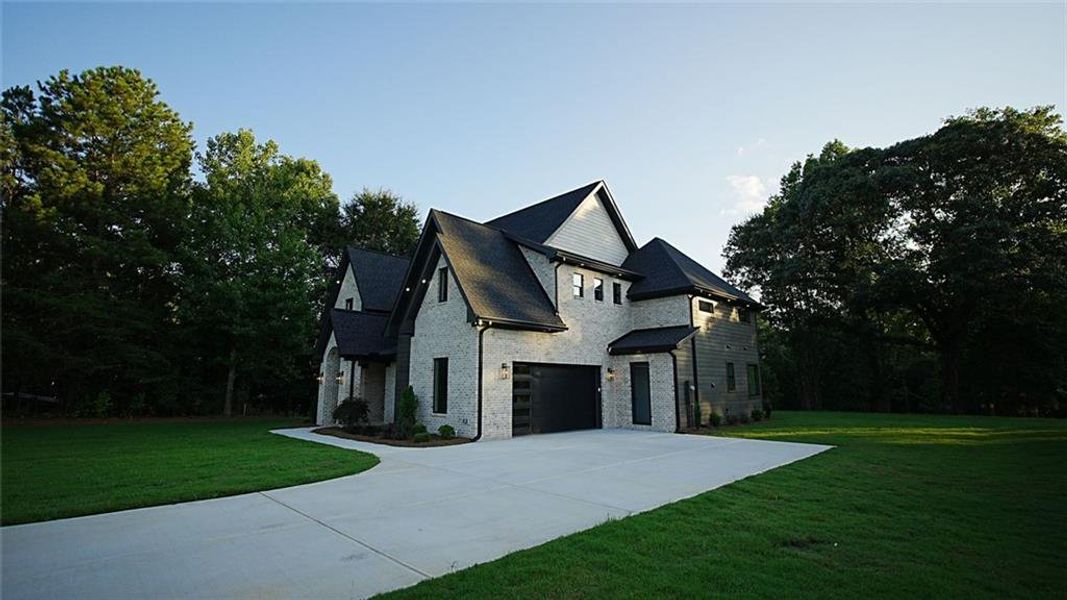 Front exterior of a new home in , Flowery Branch, GA, highlighting curb appeal (Image 27).