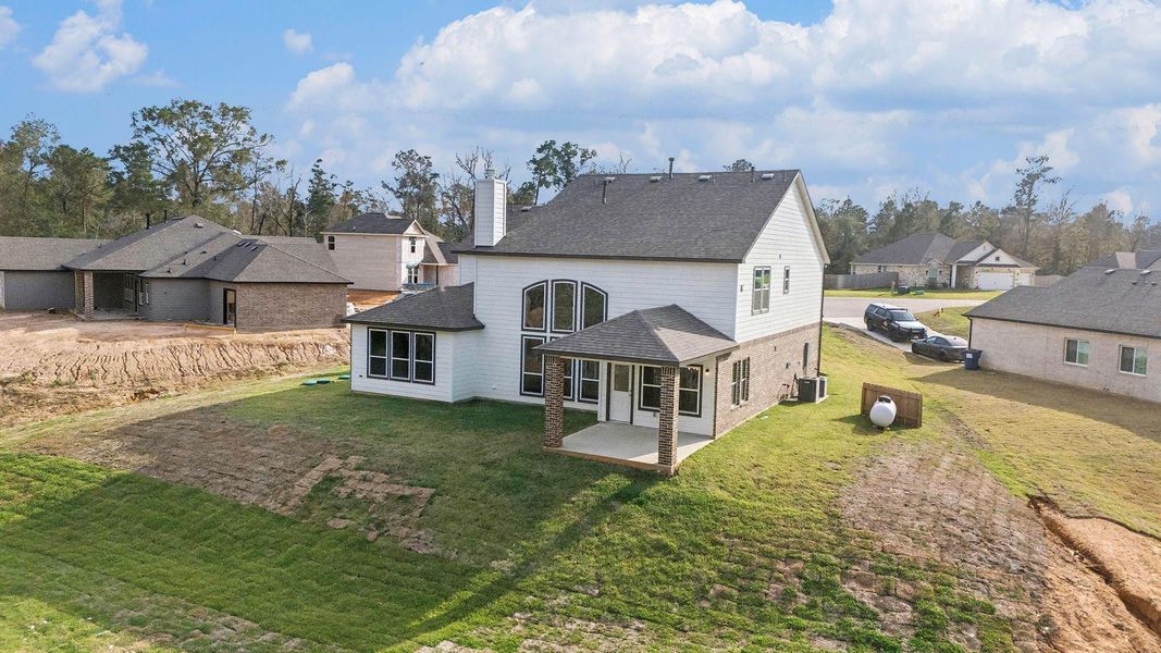 Exterior details and patio area of a home in Oakwood Ranch, Willis (Image 24).