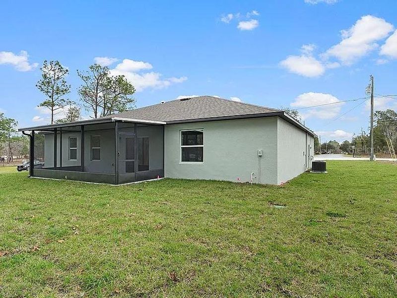 Exterior details and patio area of a home in Royal Highlands, Brooksville (Image 24).