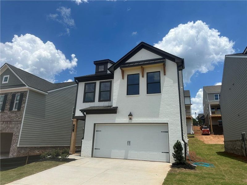 Front exterior of a new home in Kentmere, Auburn, GA, highlighting curb appeal (Image 20).
