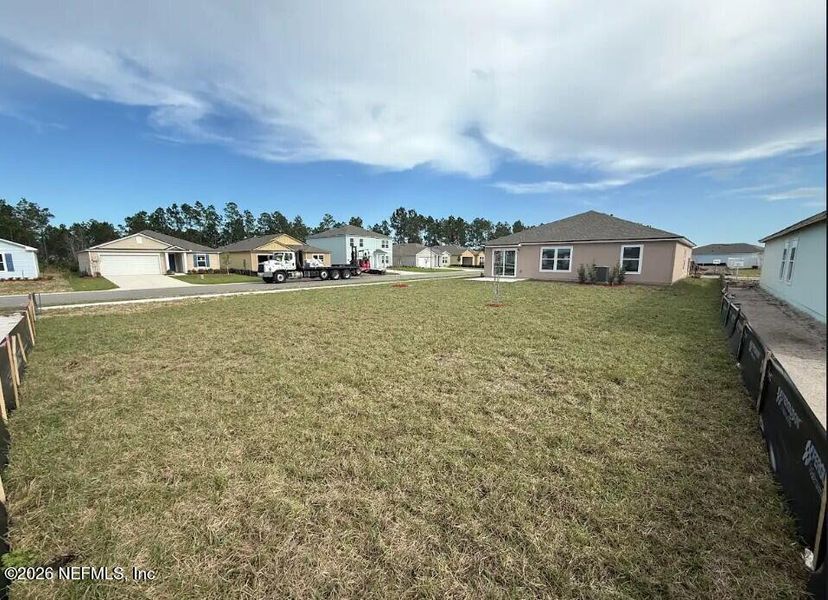 Exterior details and patio area of a home in Sawmill Branch, Palm Coast (Image 3).