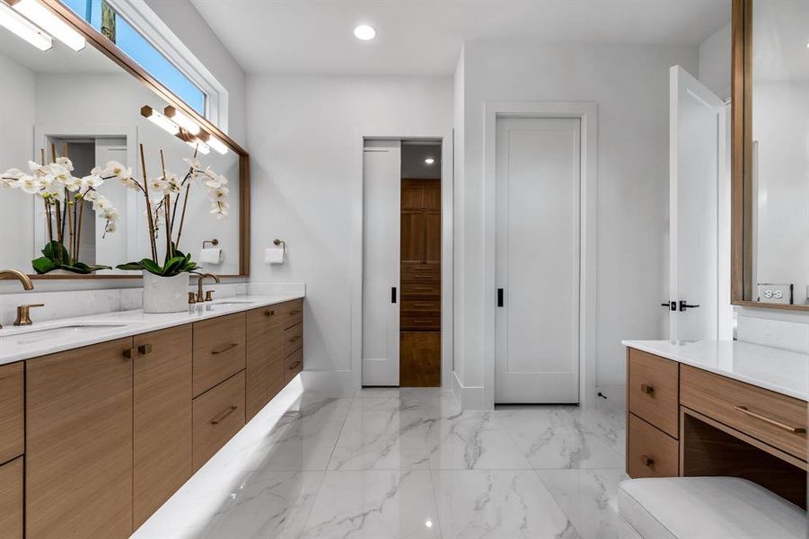 Bathroom with double vanity and tile patterned floors