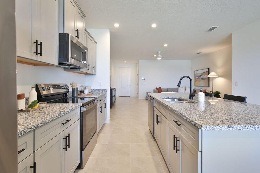 Representative furnished interior of a home built from the Morgan by Neal Communities in SkySail, Naples (Image 25).