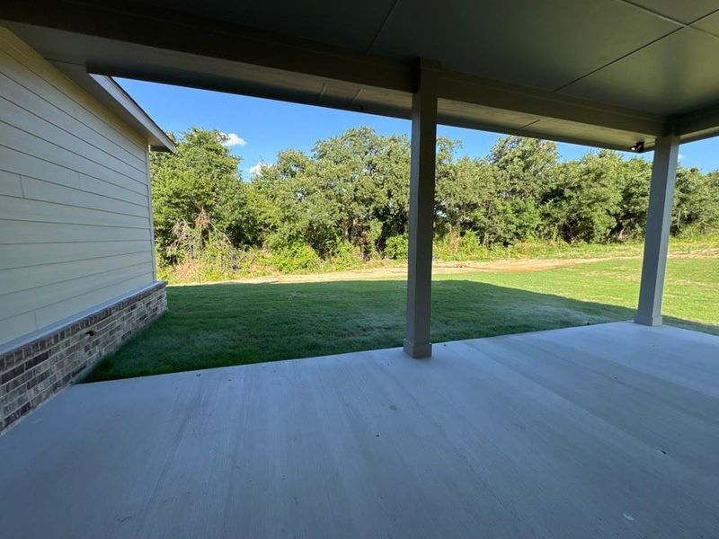 Exterior details and patio area of a home in Oak Grove Addition, Springtown (Image 4).