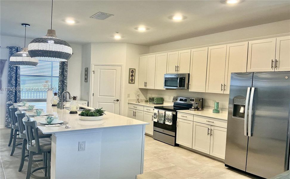 Furnished interior view inside a new home in , Ave Maria (Image 9).