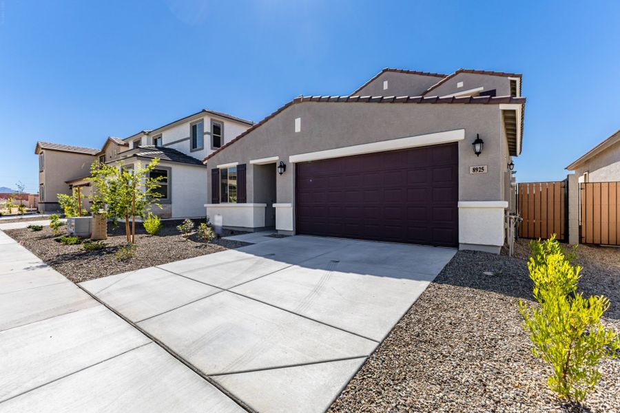 Front exterior of a new home in Rialta, Mesa, AZ, highlighting curb appeal (Image 2). Front exterior of a new home in Rialta, Mesa, AZ, highlighting curb appeal (Image 2).