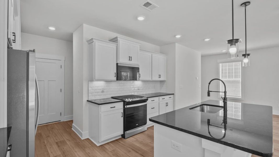 Representative furnished interior of a home built from the Jasmine by DRB Homes in Pleasant Falls, Moore (Image 7).