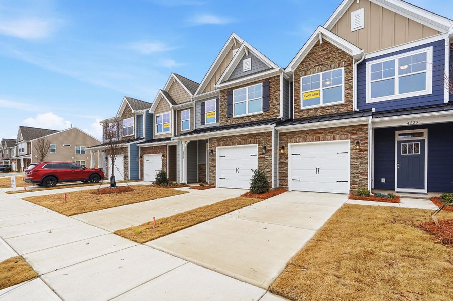 Front exterior of a new home in Harrisburg Village Townhomes, Harrisburg, NC, highlighting curb appeal (Image 26).
