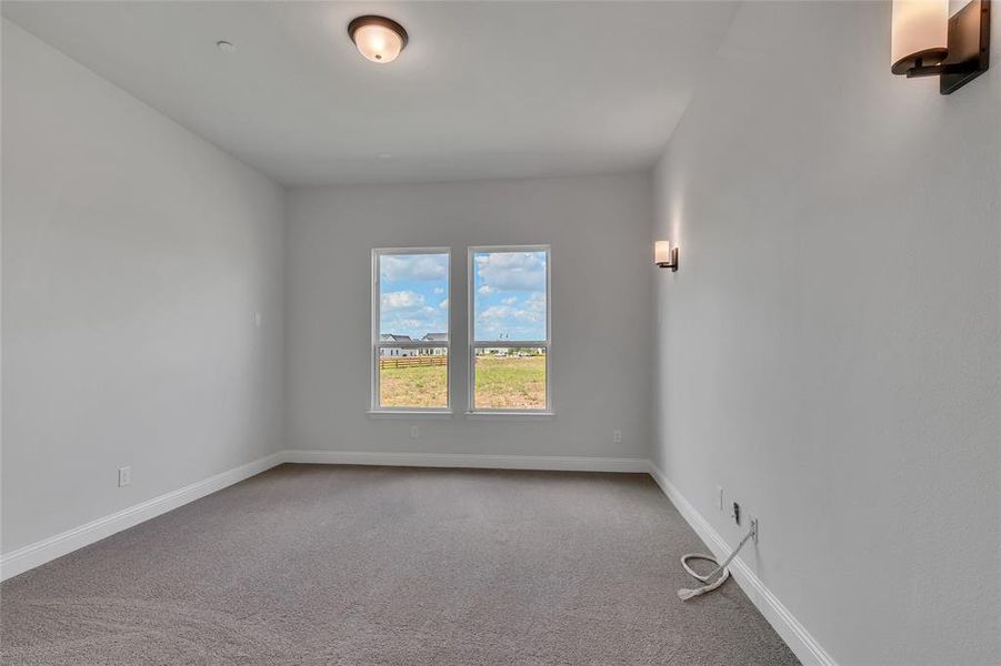 Unfurnished room with carpet flooring