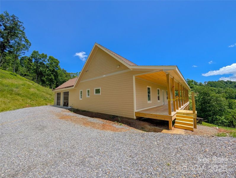 Front exterior of a new home in , Burnsville, NC, highlighting curb appeal (Image 13). Front exterior of a new home in , Burnsville, NC, highlighting curb appeal (Image 13).