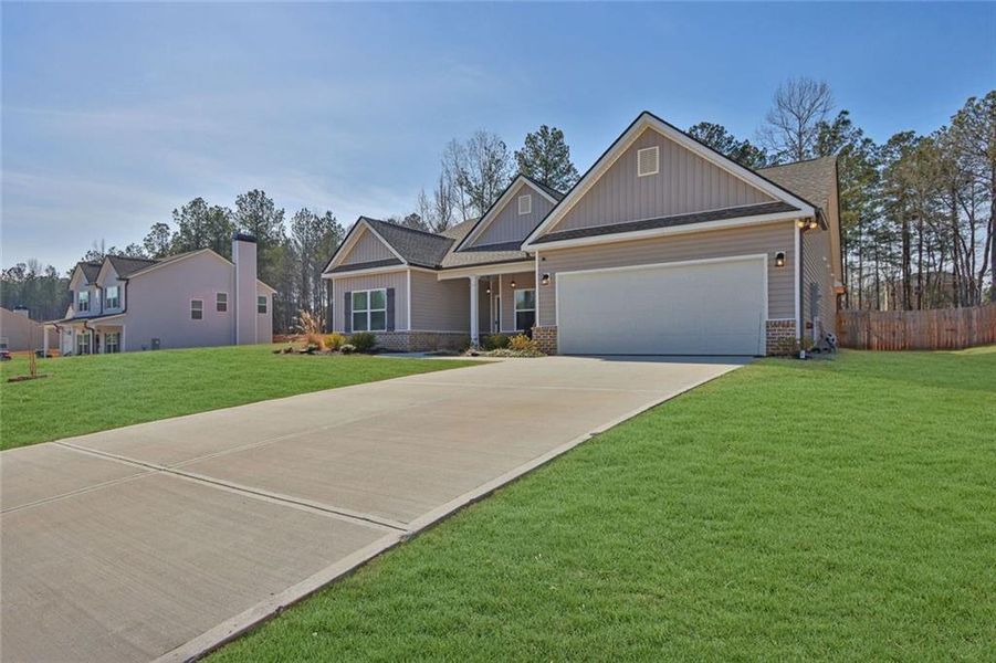 Front exterior of a new home in , Monroe, GA, highlighting curb appeal (Image 1). Front exterior of a new home in , Monroe, GA, highlighting curb appeal (Image 1).