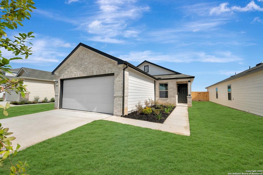 Front exterior of a new home in Park Place, New Braunfels, TX, highlighting curb appeal (Image 2). Front exterior of a new home in Park Place, New Braunfels, TX, highlighting curb appeal (Image 2).