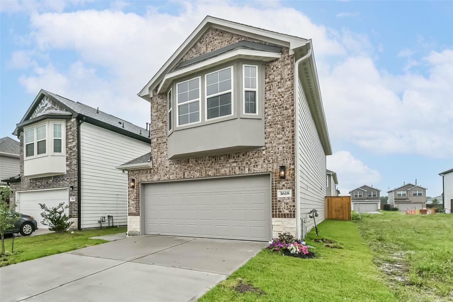 Front exterior of a new home in , Missouri City, TX, highlighting curb appeal (Image 23).